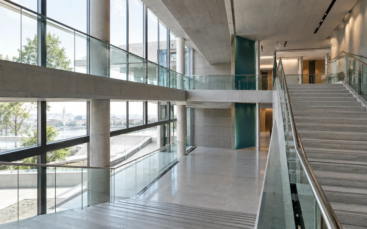 Layered walkways and staircases inside a modern civic building